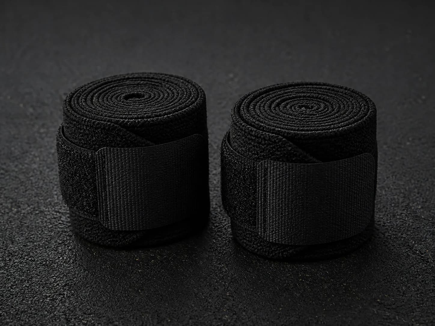 Illustrative product photograph of unbranded black wrist wraps